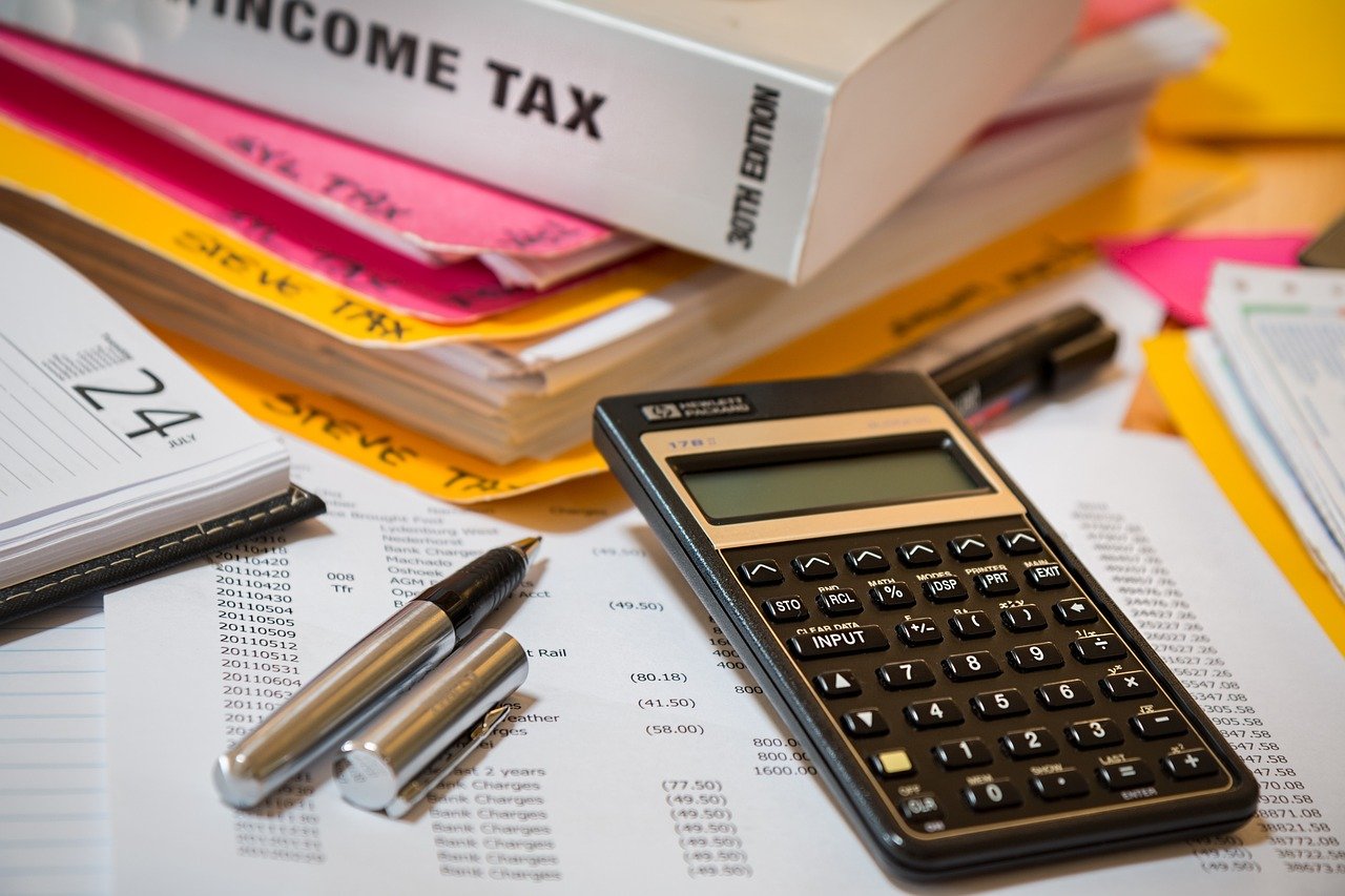 Professional tax filing — documents, calculator, and financial records